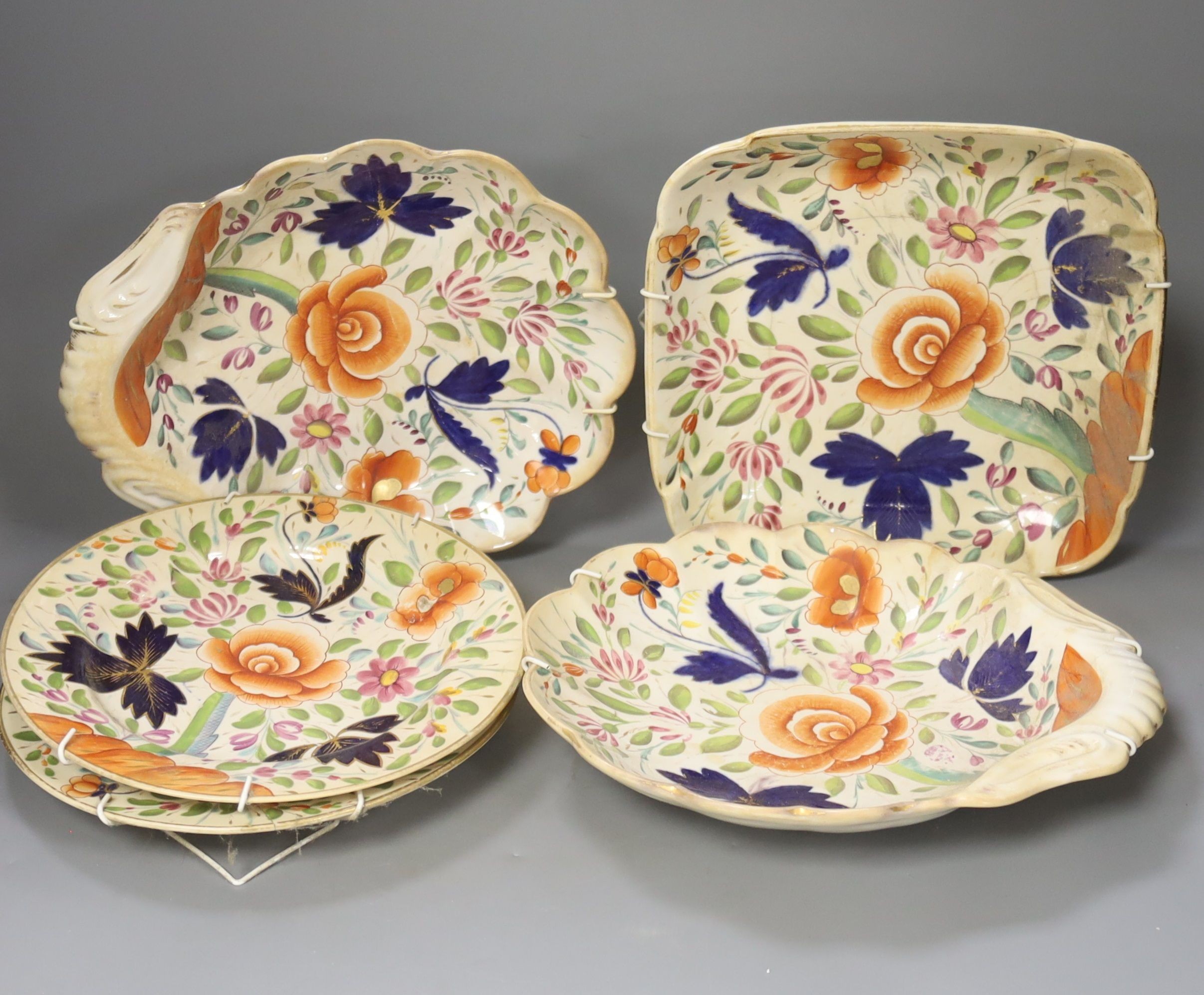 A Coalport porcelain part dessert service, circa 1820, painted with stylised flowers comprising two shell shaped dishes, square dish and two plates (5)